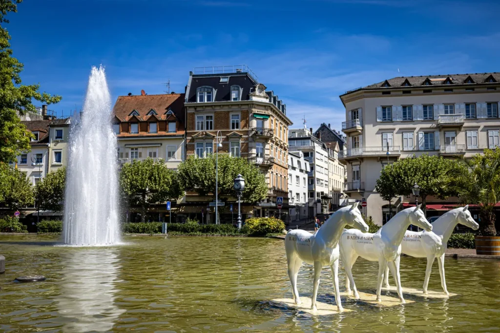 View on a public fountain at Baden-Baden city with some nice houses in the background. An ideal place for flight crews on layovers.