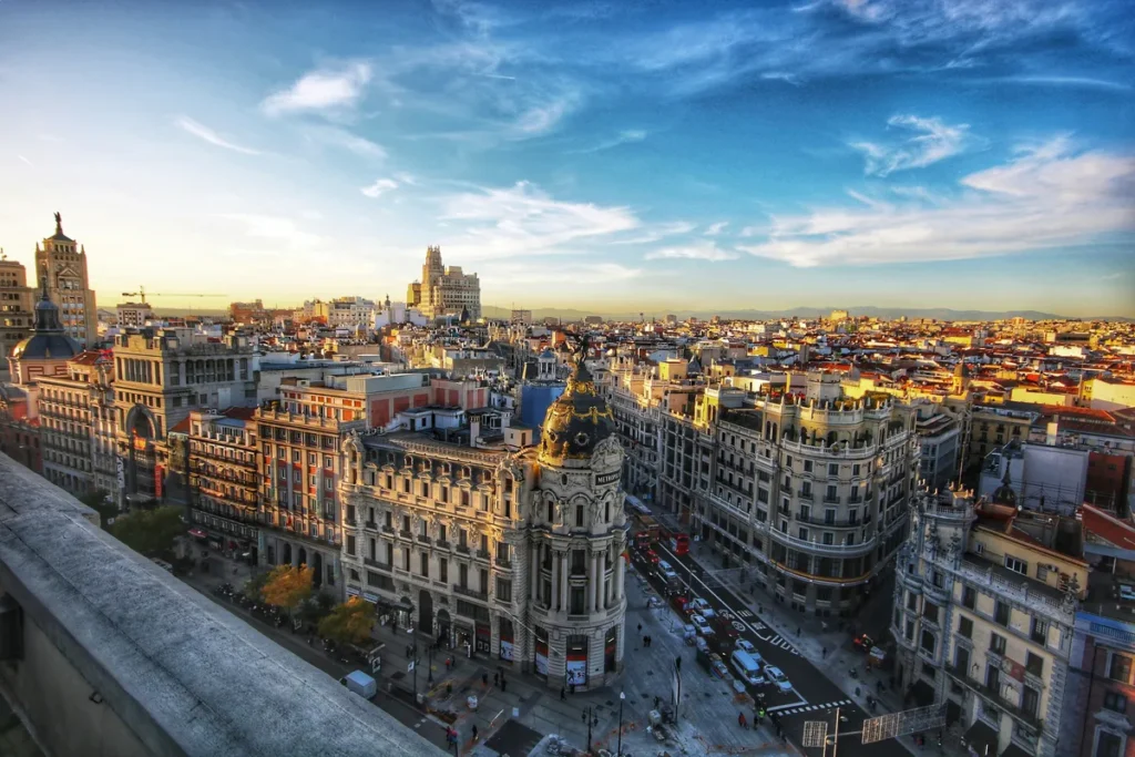 View on the inner city of Madrid, Spain, with some old houses in the foreground.
