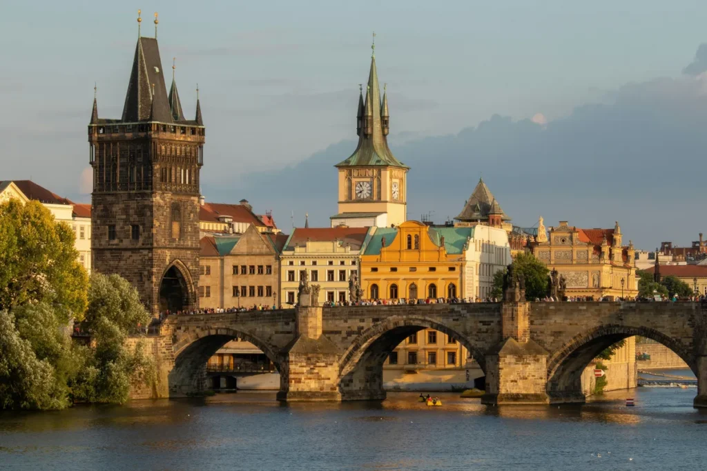 A view of one of the Vltava bridges in the foreground and downtown Prague in the background.